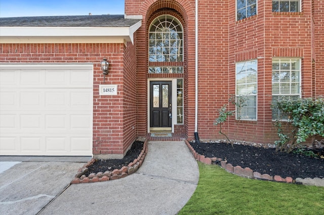 view of exterior entry featuring a garage