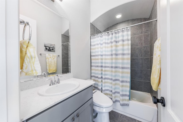 full bathroom with tile patterned flooring, vanity, shower / tub combo, and toilet