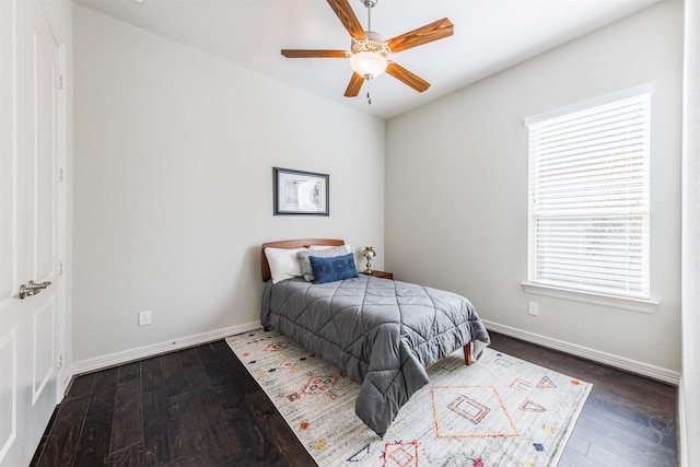 bedroom with ceiling fan and dark wood-type flooring