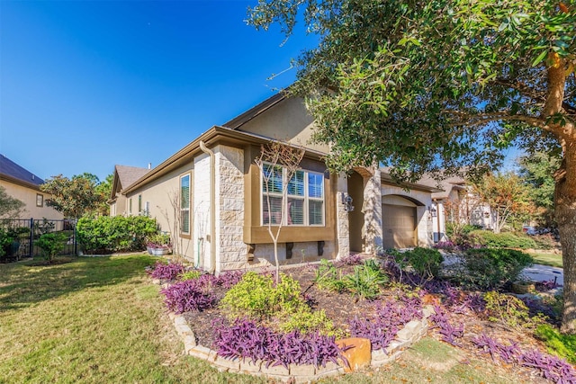 exterior space with a front lawn and a garage