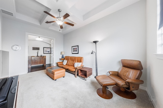 living area with carpet and ceiling fan