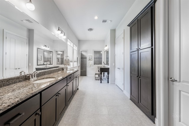 bathroom with vanity and tile patterned floors