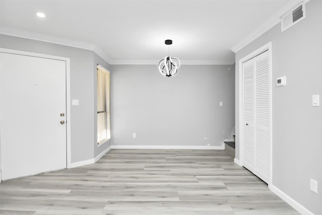 unfurnished dining area with a chandelier, crown molding, and light hardwood / wood-style flooring