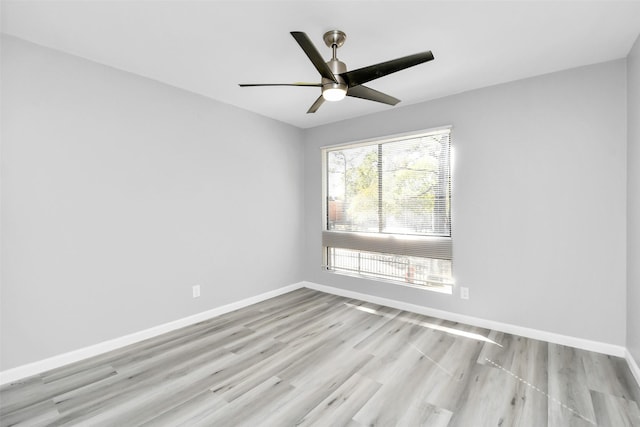 spare room featuring ceiling fan and light hardwood / wood-style floors