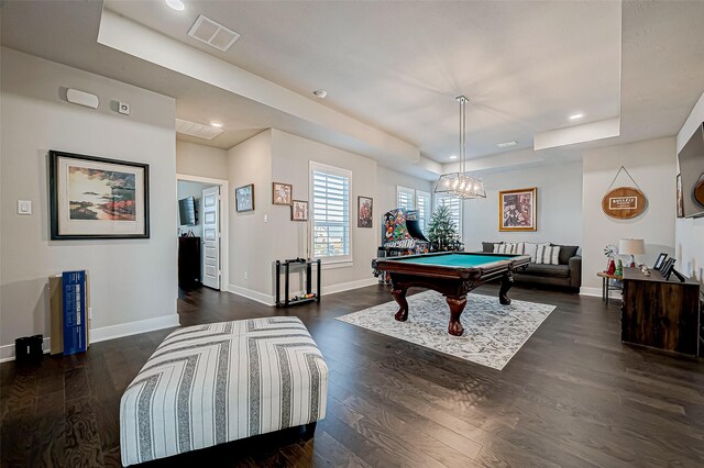 playroom with a tray ceiling, dark hardwood / wood-style floors, and pool table