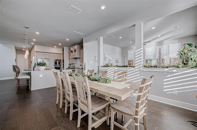 dining space with dark hardwood / wood-style flooring