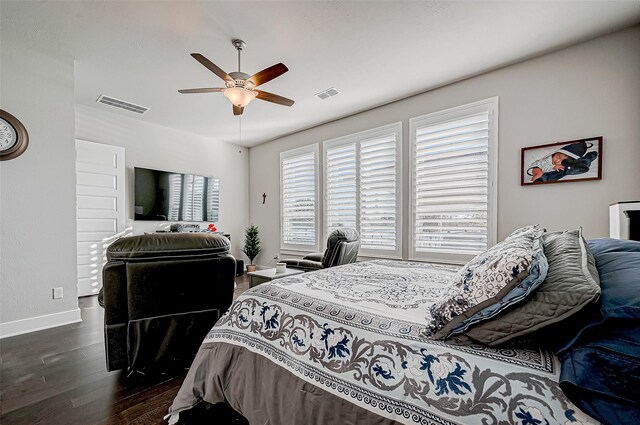 bedroom featuring ceiling fan and dark hardwood / wood-style floors