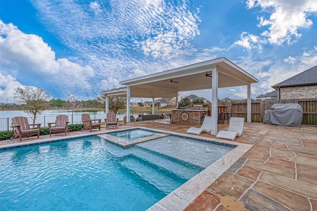 view of pool featuring fence, grilling area, and a patio area