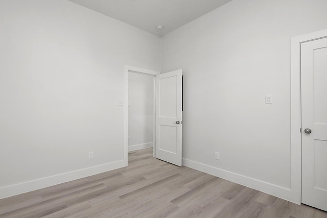 spare room with light wood-type flooring