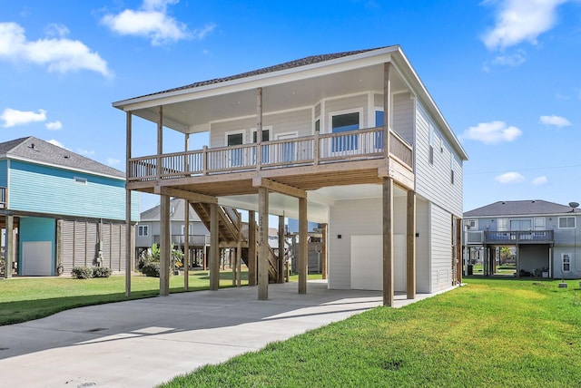 view of front of house featuring a carport, a porch, a garage, and a front lawn