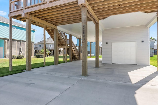 view of patio with a garage, a carport, and a deck