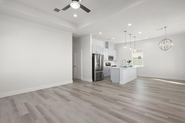 22803 Miramar Dr, Galveston, TX 77554 - kitchen with appliances with stainless steel finishes, open floor plan, ceiling fan, light countertops, and recessed lighting