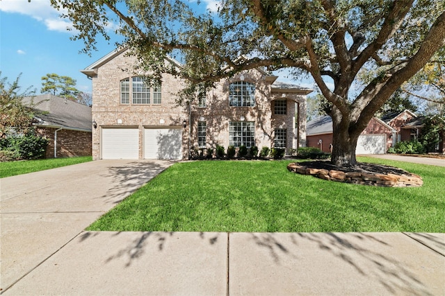 view of front of home featuring a garage and a front lawn