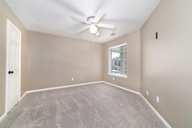 carpeted empty room with ceiling fan