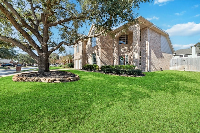 exterior space featuring a garage and a front yard