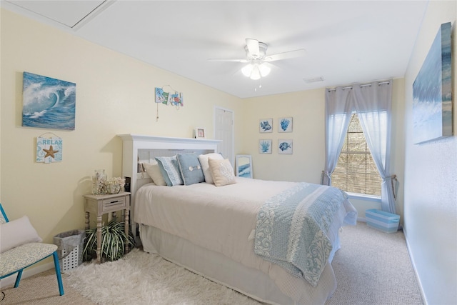 bedroom with light colored carpet and ceiling fan