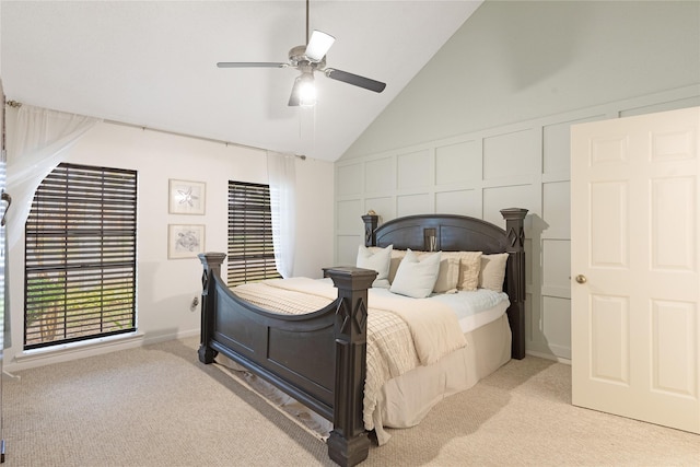 carpeted bedroom featuring ceiling fan and lofted ceiling