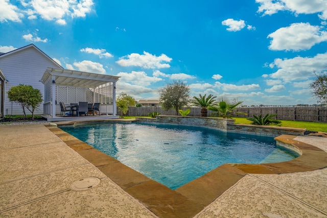 view of swimming pool with a patio area and a pergola