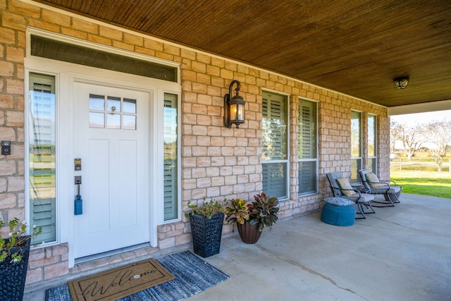 property entrance featuring a porch