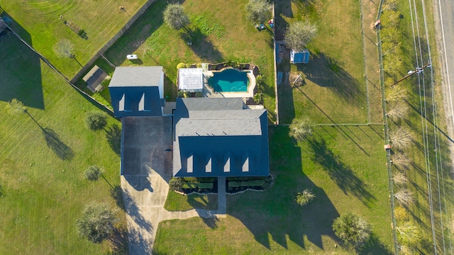 birds eye view of property with a rural view