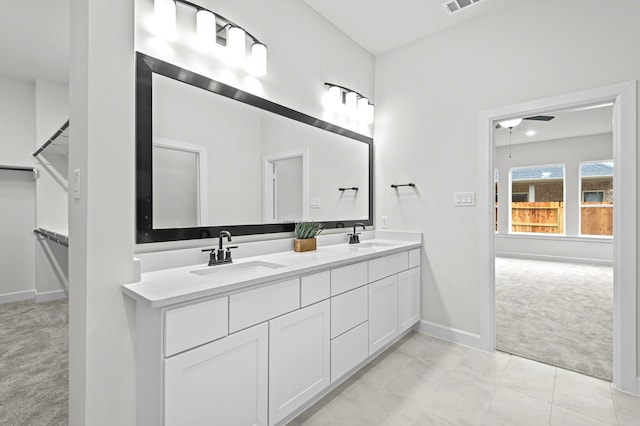 bathroom featuring ceiling fan, tile patterned floors, and vanity