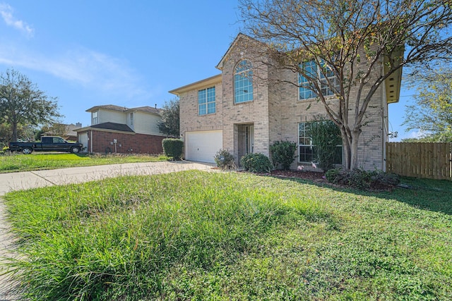 view of front facade with a garage and a front lawn