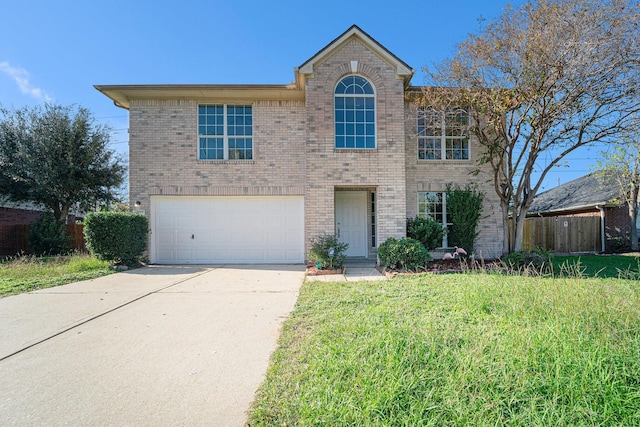 view of front of home with a garage and a front lawn