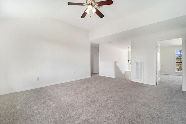 empty room featuring carpet flooring, ceiling fan, and vaulted ceiling