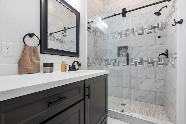 bathroom featuring vanity and an enclosed shower