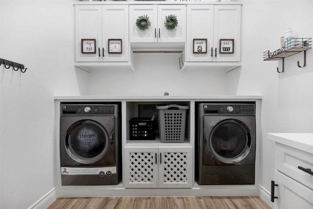 laundry area with light hardwood / wood-style flooring