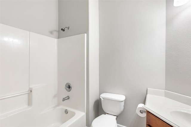 full bathroom featuring vanity, washtub / shower combination, and toilet