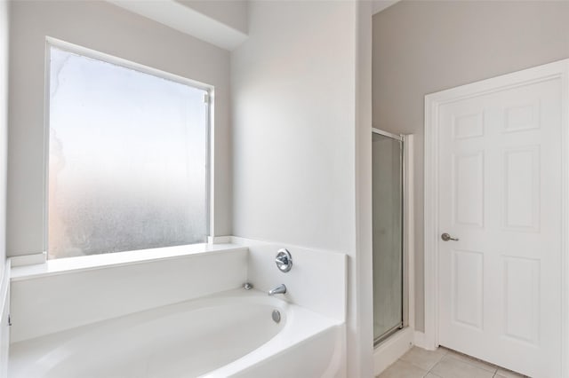 bathroom featuring separate shower and tub and tile patterned floors