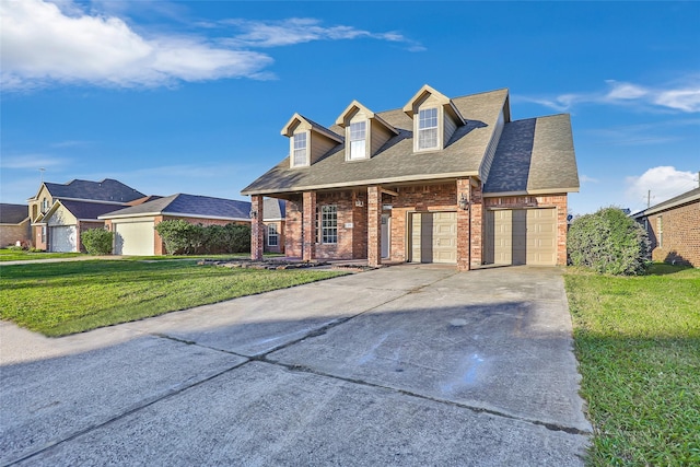 cape cod home with a garage and a front yard