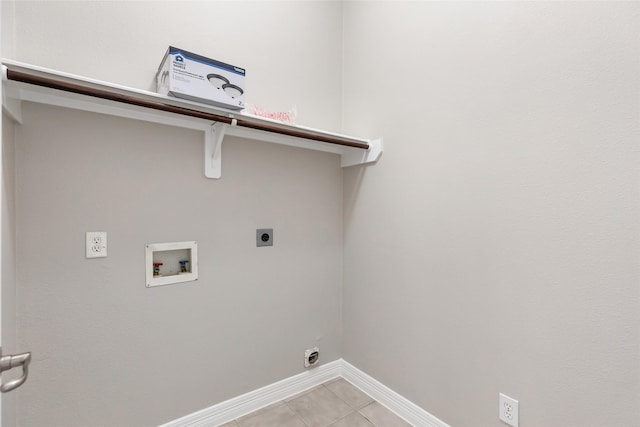 laundry room with hookup for an electric dryer, light tile patterned flooring, and hookup for a washing machine