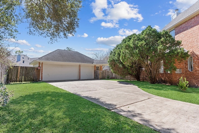 ranch-style home featuring brick siding, fence, and a front lawn