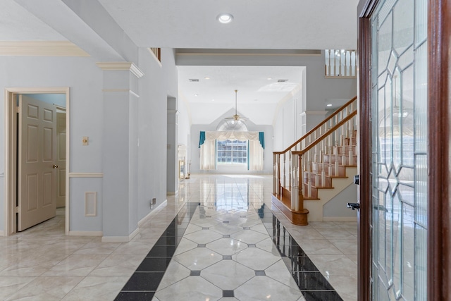 foyer with recessed lighting, a towering ceiling, baseboards, stairs, and ornamental molding