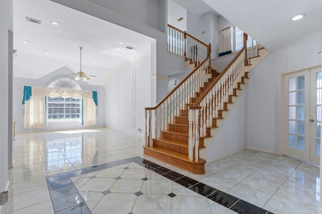 entrance foyer featuring high vaulted ceiling, recessed lighting, visible vents, baseboards, and french doors