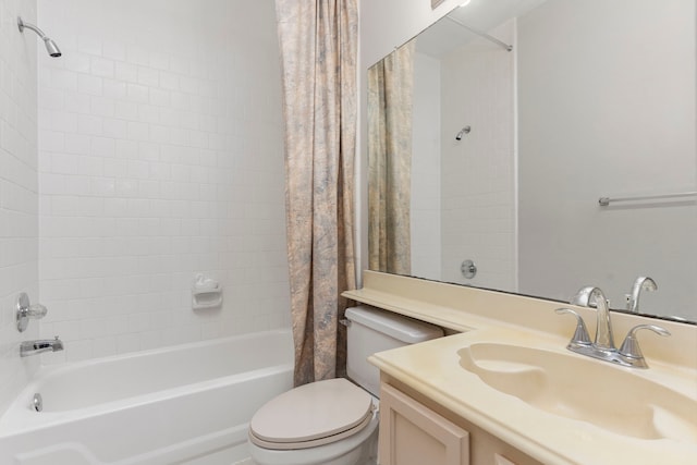 bathroom with shower / bath combo, vanity, and toilet