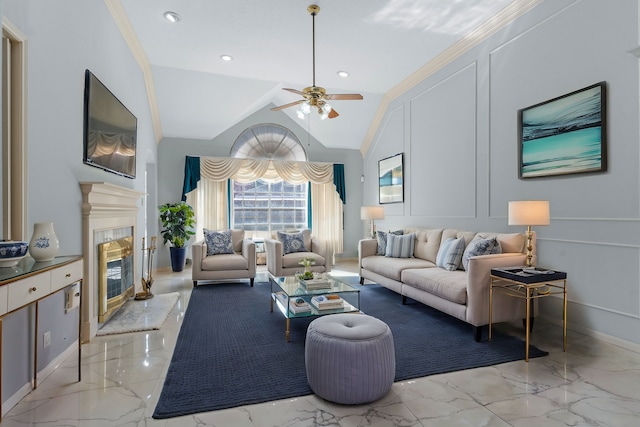 living room with lofted ceiling, marble finish floor, a decorative wall, and a glass covered fireplace