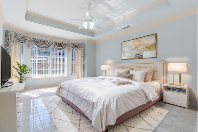 bedroom featuring a raised ceiling, visible vents, crown molding, and light tile patterned floors