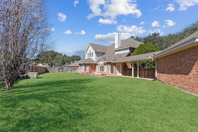 view of yard featuring a fenced backyard