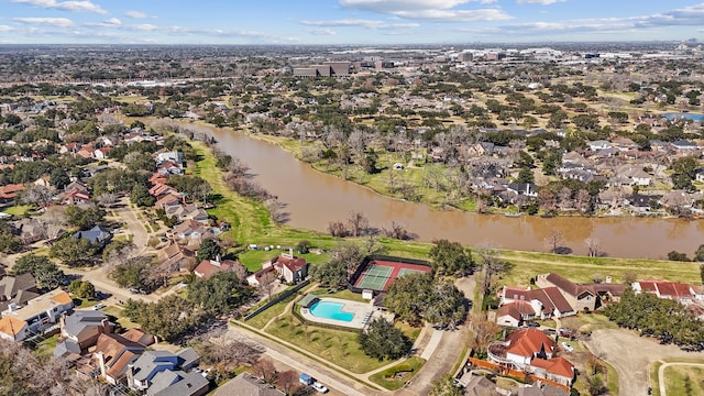 drone / aerial view with a residential view and a water view