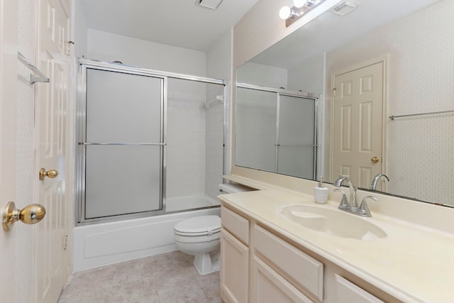 bathroom with visible vents, toilet, combined bath / shower with glass door, vanity, and wallpapered walls