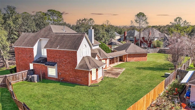 aerial view at dusk with a residential view