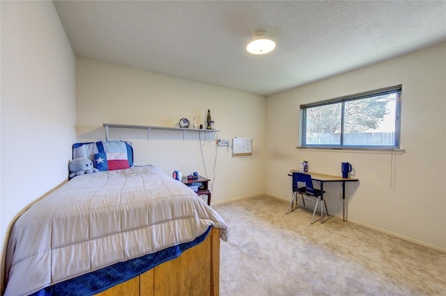 carpeted bedroom featuring a textured ceiling