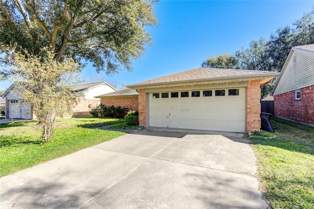 view of front of house with a garage and a front lawn