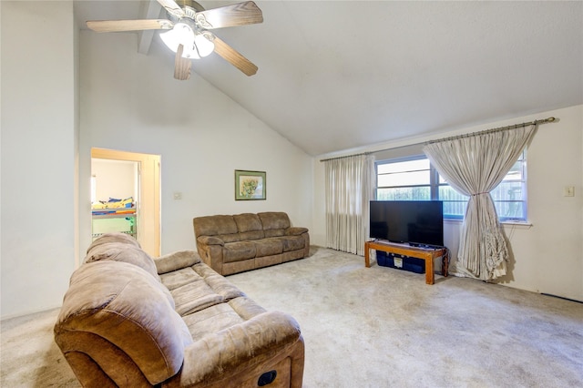 carpeted living room with ceiling fan and high vaulted ceiling