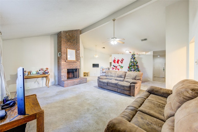 carpeted living room with ceiling fan, beamed ceiling, high vaulted ceiling, and a brick fireplace