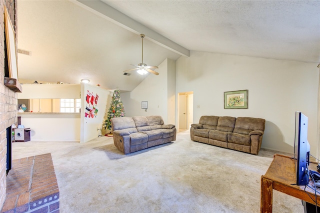 living room with carpet, a brick fireplace, ceiling fan, beam ceiling, and high vaulted ceiling