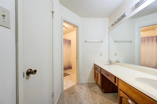 bathroom featuring vanity and a textured ceiling